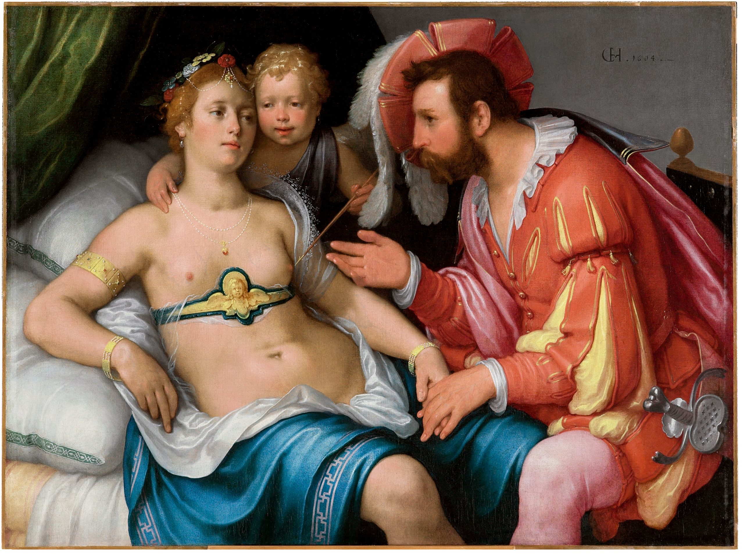 Cornelis van Haarlems 'Mars und Venus mit Amor' (1604): Venus ruht auf einem prunkvollen Bett, während der bärtige Mars in leuchtend roter Renaissance-Rüstung sich zu ihr beugt. Zwischen ihnen ist Amor als nacktes Kind dargestellt. Die Ölmalerei besticht durch die detailreiche Darstellung kostbarer Stoffe, Schmuck und sinnlicher Atmosphäre im niederländischen Manierismus.